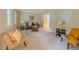 Spacious living room featuring neutral walls, plush carpet, and ample natural light, great for relaxing at 5841 Covered Wagon Trl, Lilburn, GA 30047