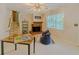 Cozy living room features a fireplace, staircase, and a large window at 5841 Covered Wagon Trl, Lilburn, GA 30047
