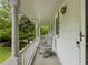 Cozy covered porch featuring rocking chairs, perfect for enjoying the outdoors in comfort at 5841 Covered Wagon Trl, Lilburn, GA 30047