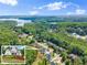 Beautiful home with mature trees near a stunning lake with a bridge at 5875 Windjammer Pt, Cumming, GA 30041