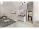 This bathroom features granite countertops, white cabinets, and decor touches at 5875 Windjammer Pt, Cumming, GA 30041