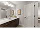 This is a bright primary bathroom featuring neutral walls and a dark sink at 5875 Windjammer Pt, Cumming, GA 30041