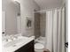 Bathroom featuring a shower/tub combo and dark wood vanity at 5875 Windjammer Pt, Cumming, GA 30041
