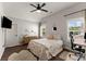 Bedroom featuring a ceiling fan, hardwood floors, and a desk at 5875 Windjammer Pt, Cumming, GA 30041