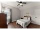 Cozy bedroom with a window and a single bed, perfect for a guest room at 5875 Windjammer Pt, Cumming, GA 30041