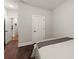 Neutral bedroom with hardwood floors at 5875 Windjammer Pt, Cumming, GA 30041