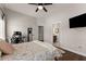 Bedroom with hardwood floors and access to an ensuite bathroom at 5875 Windjammer Pt, Cumming, GA 30041