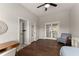 Bedroom featuring hardwood floors, a walk-in closet, and french doors at 5875 Windjammer Pt, Cumming, GA 30041