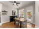 Cozy dining area with natural light, shelving, and a view of the backyard patio at 5875 Windjammer Pt, Cumming, GA 30041