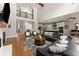 Spacious living room featuring hardwood floors and a modern, open floor plan at 5875 Windjammer Pt, Cumming, GA 30041