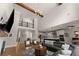 Open floor plan with a view of the second-story landing, a kitchen, and a dining area at 5875 Windjammer Pt, Cumming, GA 30041