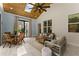 Comfortable sunroom with vaulted ceiling, wood beams and lots of natural light at 5875 Windjammer Pt, Cumming, GA 30041