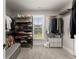 A view of the walk-in closet featuring shelving, window, and organization at 5875 Windjammer Pt, Cumming, GA 30041