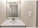 Bright bathroom featuring a modern vanity with a white countertop and silver fixtures at 8541 Westchester Dr, Douglasville, GA 30134