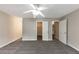 Cozy bedroom featuring neutral carpet, a ceiling fan, and closet space at 8541 Westchester Dr, Douglasville, GA 30134
