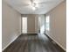 Large bedroom features carpeting, a ceiling fan, closet, and a window overlooking backyard at 8541 Westchester Dr, Douglasville, GA 30134