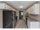 Efficient kitchen featuring stainless steel appliances, granite counters, and ample cabinet space at 8541 Westchester Dr, Douglasville, GA 30134