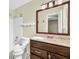 Bathroom with dark wood cabinets and marble countertops at 103 Sir Gregory Nw Mnr, Lawrenceville, GA 30044