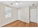 Bedroom with hardwood floors and natural light from shuttered window at 103 Sir Gregory Nw Mnr, Lawrenceville, GA 30044