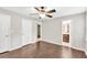 Spacious bedroom features hardwood floors, ceiling fan, and access to the ensuite bathroom at 103 Sir Gregory Nw Mnr, Lawrenceville, GA 30044