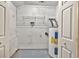 Utility room featuring utility shelving, water heater and hookups at 103 Sir Gregory Nw Mnr, Lawrenceville, GA 30044