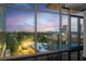 Stunning city skyline view from a private balcony through floor to ceiling windows at dusk at 250 Pharr Ne Rd # 716, Atlanta, GA 30305