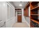 Organized walk-in closet with custom shelving and ample storage space and shelving at 250 Pharr Ne Rd # 716, Atlanta, GA 30305