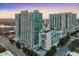 Aerial view of luxury apartment complex featuring modern architecture and a rooftop pool with city views at 250 Pharr Ne Rd # 716, Atlanta, GA 30305