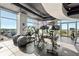 Bright community gym featuring modern equipment, weights, and floor to ceiling windows overlooking the city at 250 Pharr Ne Rd # 716, Atlanta, GA 30305