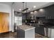 Contemporary kitchen featuring stainless steel appliances, dark cabinets, and granite countertops at 250 Pharr Ne Rd # 716, Atlanta, GA 30305