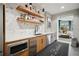 Updated kitchenette featuring stainless steel appliances, sleek countertops, and chic wall decor at 250 Pharr Ne Rd # 716, Atlanta, GA 30305