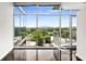 Modern living room with floor-to-ceiling windows offering a panoramic city view and access to a balcony at 250 Pharr Ne Rd # 716, Atlanta, GA 30305