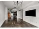 Open-concept living space with sleek flooring and kitchen access at 250 Pharr Ne Rd # 716, Atlanta, GA 30305