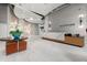 Elegant building lobby with modern decor, a marble reception desk, and stylish seating area at 250 Pharr Ne Rd # 716, Atlanta, GA 30305