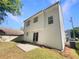View of the backyard with a patio and a well-maintained lawn at 7007 Setters Way, Lithonia, GA 30038