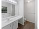 Bright bathroom featuring a large mirror, sleek vanity, and modern fixtures for a refreshing experience at 7007 Setters Way, Lithonia, GA 30038