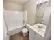 Clean bathroom featuring a shower over tub, a white vanity with mirror, and flooring at 7007 Setters Way, Lithonia, GA 30038