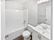 Clean bathroom featuring a shower and tub, vanity, and white fixtures, perfect for relaxation at 7007 Setters Way, Lithonia, GA 30038