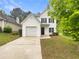 Charming two-story home with a well-maintained front yard and inviting entrance at 7007 Setters Way, Lithonia, GA 30038
