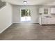 Bright, open living space with durable floors, fresh paint, and a sliding glass door to the yard at 7007 Setters Way, Lithonia, GA 30038