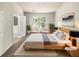 Serene bedroom with ample natural light, neutral tones, and a view to the bathroom at 7007 Setters Way, Lithonia, GA 30038