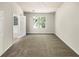 Serene bedroom with ample natural light, carpet flooring, and a view to the bathroom at 7007 Setters Way, Lithonia, GA 30038