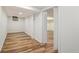 Finished basement offers ample space with wood-look flooring and fresh white paint at 106 Hickory Ave, Fayetteville, GA 30215