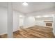 Basement featuring hardwood floors and a brick fireplace at 106 Hickory Ave, Fayetteville, GA 30215