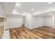Basement featuring hardwood floors and a brick fireplace at 106 Hickory Ave, Fayetteville, GA 30215
