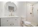 Bright bathroom features a vanity with marble countertop, gold fixtures, and a tiled walk-in shower at 106 Hickory Ave, Fayetteville, GA 30215
