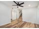 Living room featuring hardwood floors, ceiling fan and staircase to an upper floor at 106 Hickory Ave, Fayetteville, GA 30215