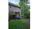 Backyard view with wooden deck and an unfinished storage area at 3643 Fowler Rdg, Douglasville, GA 30135