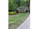 Well-maintained lawn and neatly trimmed bushes in the front yard of this home at 3643 Fowler Rdg, Douglasville, GA 30135