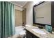 Bathroom with a shower-tub, a granite vanity and modern fixtures at 4415 Saint Andrews Crest Dr, Cumming, GA 30040
